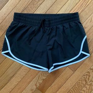 Black athletic shorts with white lining